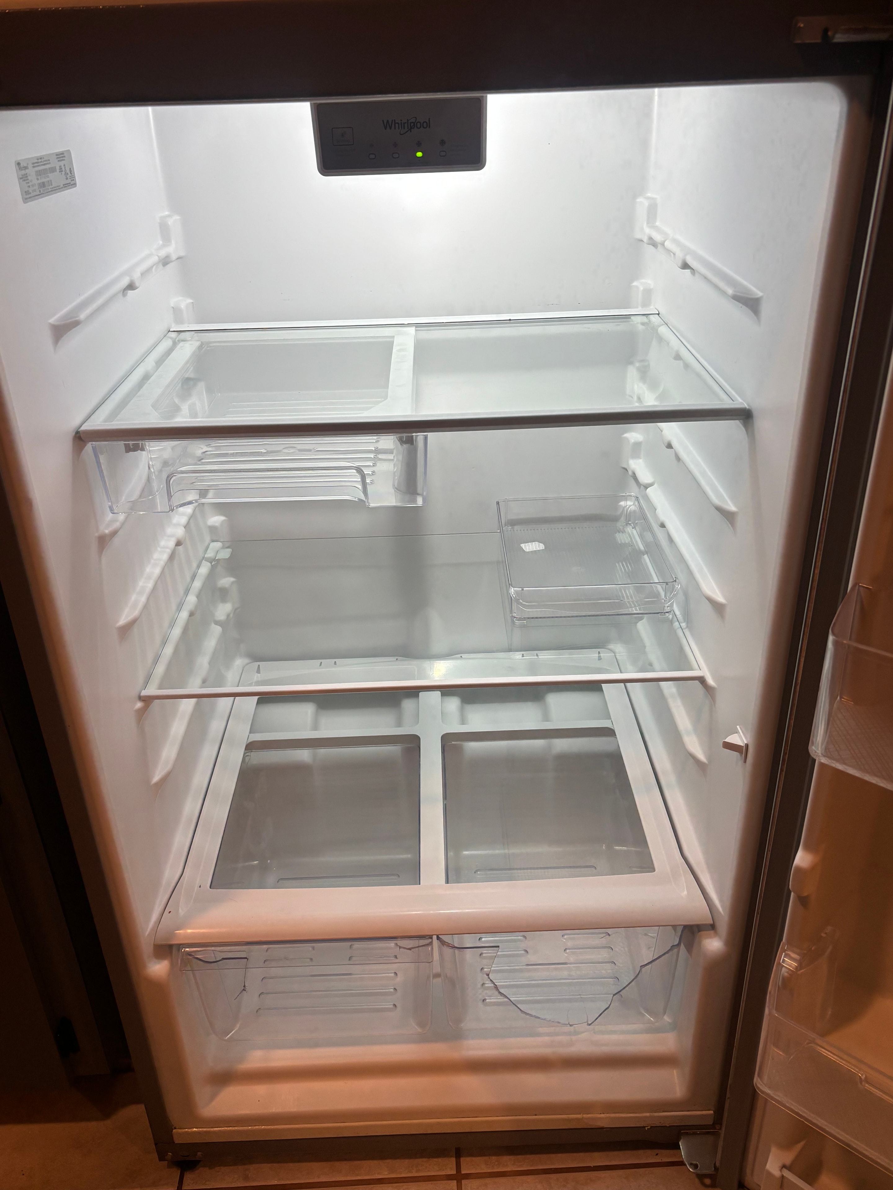 Refrigerator interior spotless white after cleaning